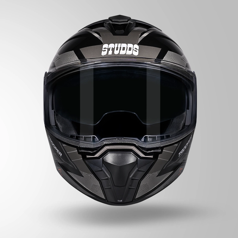 Front view of Studds Trooper Racer D4 Black Orange N4 Grey Flip Up Helmet with closed visor for motorcycle enthusiasts.